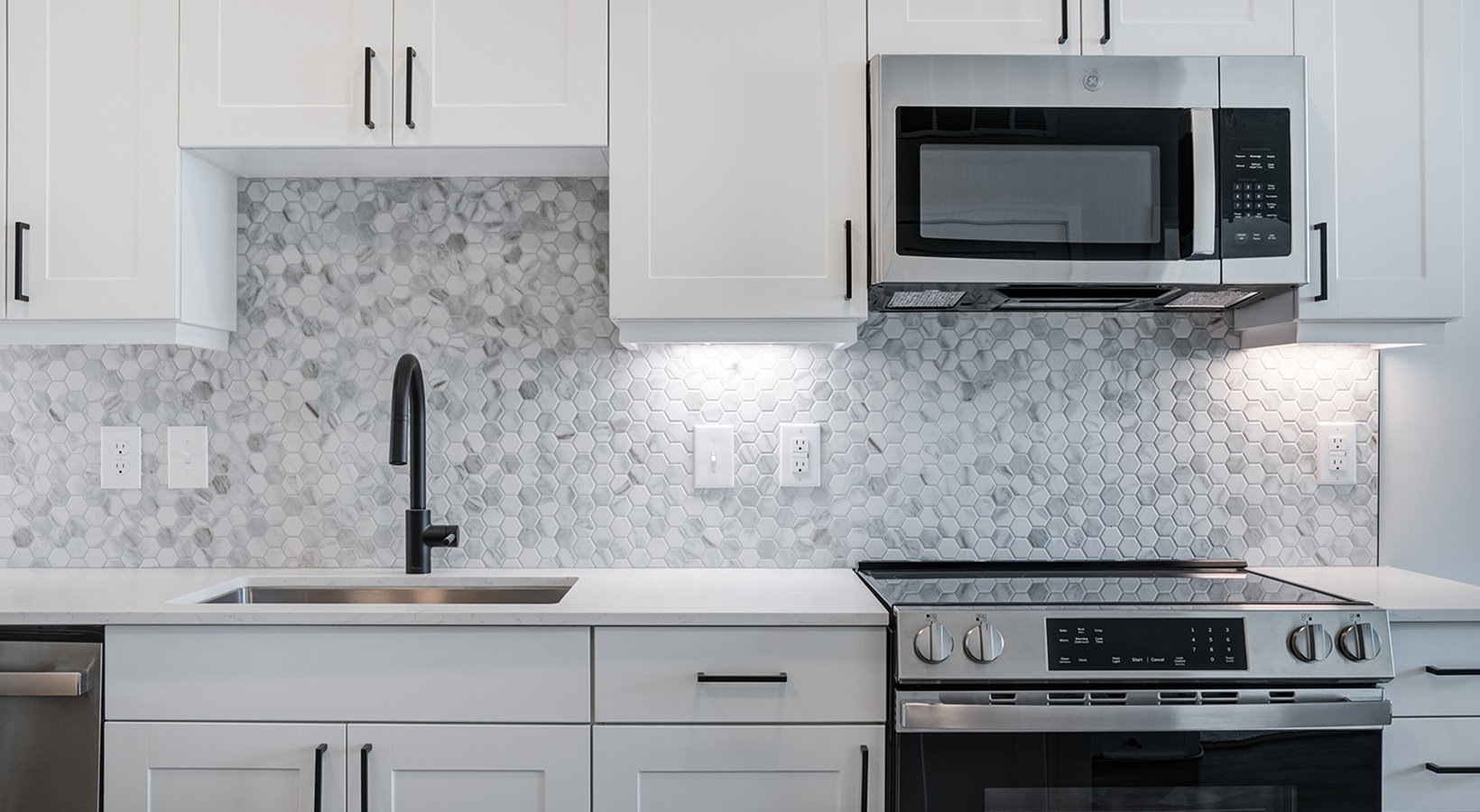 kitchen with white cabinets and stainless steel appliances J Optimist Park Charlotte NC luxury apartments