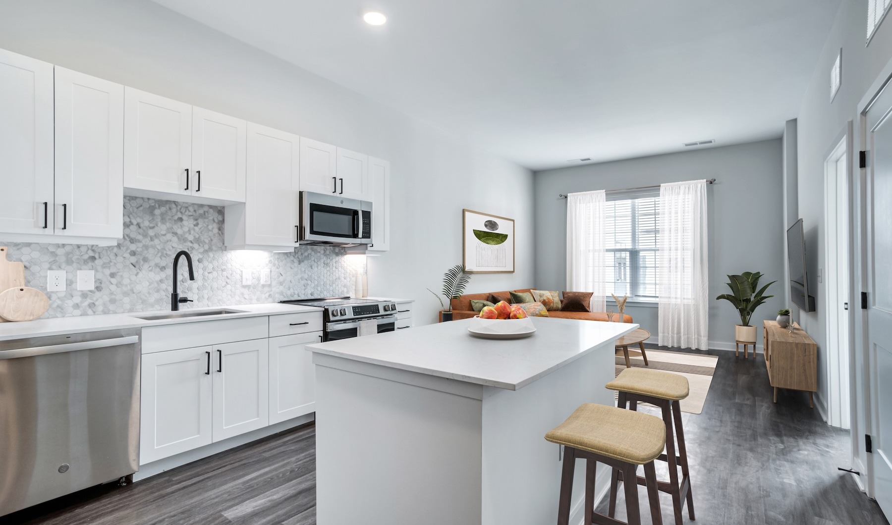 The essence of exceptional living Well-lit kitchen with ample counter space